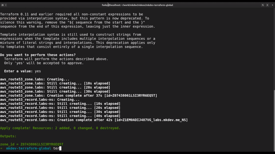 A computer terminal screen showing the execution of Terraform commands for provisioning AWS resources with output indicating successful creation.