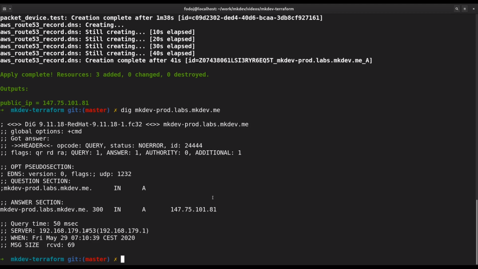 A screenshot of a computer terminal with code output showing AWS resource creation statuses and the result of a DNS lookup using the 'dig' command.