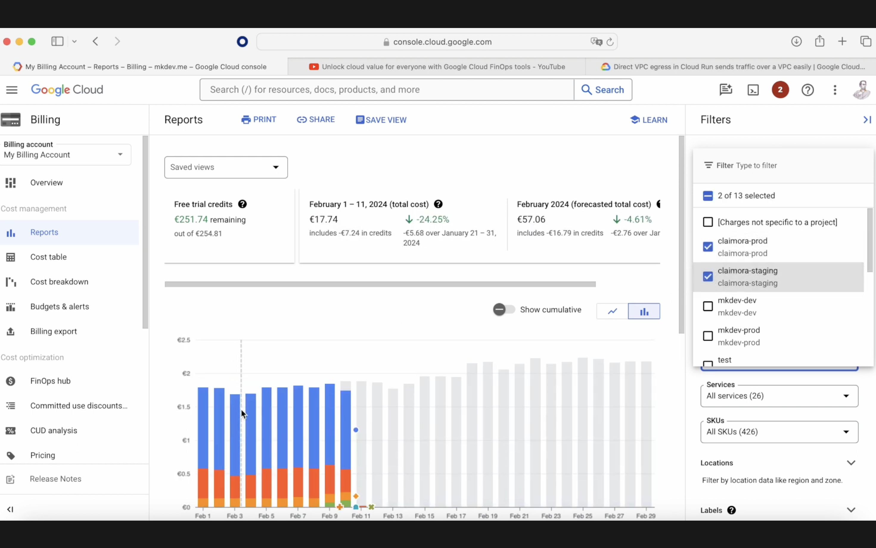 Screenshot of Google Cloud billing interface showing reports with bar graph of daily costs, free trial credit information, and filter options on the right side.