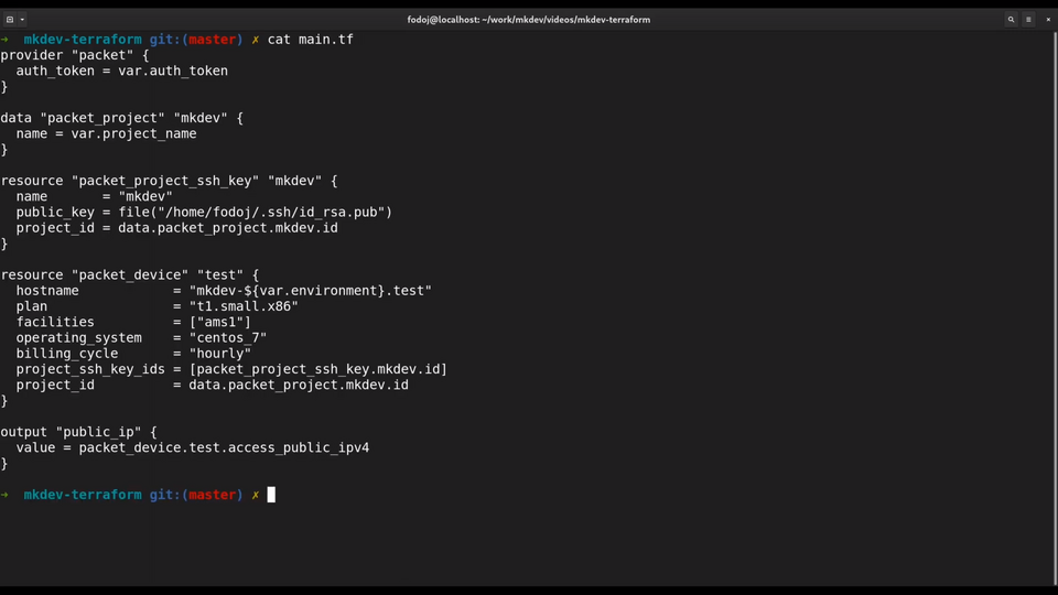 A computer screen displaying a Terraform configuration file in a text editor, with code for provisioning infrastructure, including sections for provider, project, SSH key, and device.