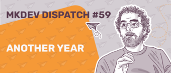Graphic banner for MKDEV Dispatch #59 featuring an illustration of a man with glasses and curly hair, with the text "Another Year" against an orange background with paper plane motifs.