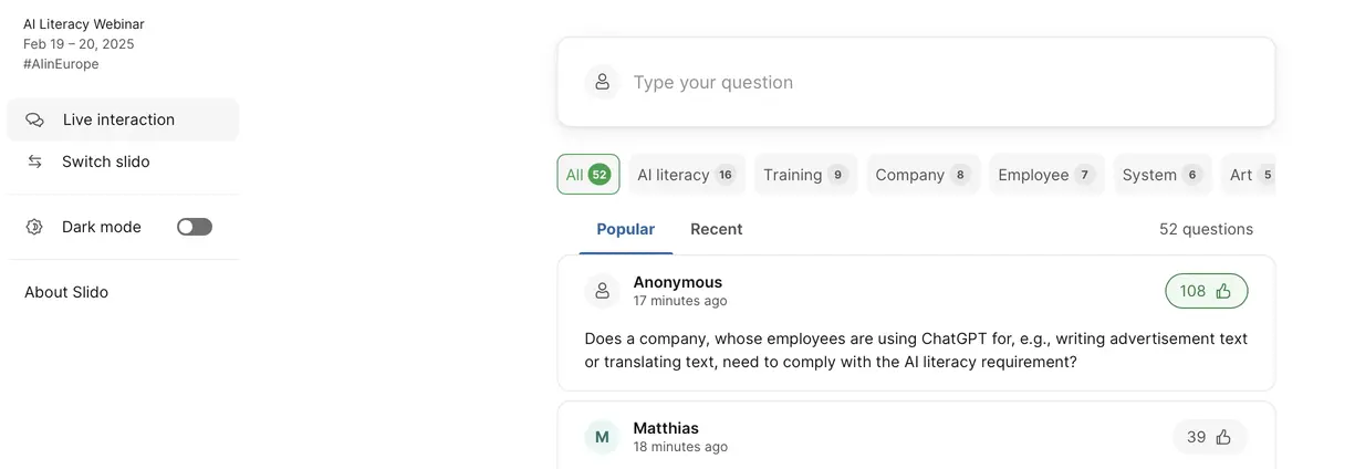 Interface of a webinar titled "AI Literacy Webinar" scheduled for February 19-20, 2025. Features include live interaction, slide switching, and dark mode toggle. A question about AI literacy and ChatGPT has 108 likes. Categories such as AI literacy and Training are shown with question counts.