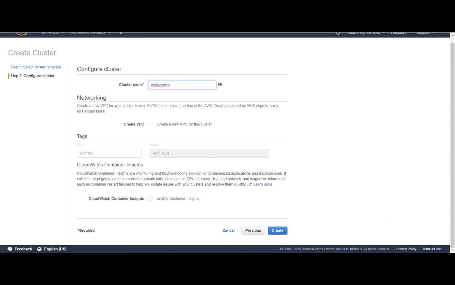 Screenshot of AWS Create Cluster page in Step 2: Configure Cluster section. Includes fields for Cluster Name, Networking options for creating VPC, input fields for Tags, and a checkbox for enabling CloudWatch Container Insights. Buttons for 'Cancel,' 'Previous,' and 'Create' are at the bottom.